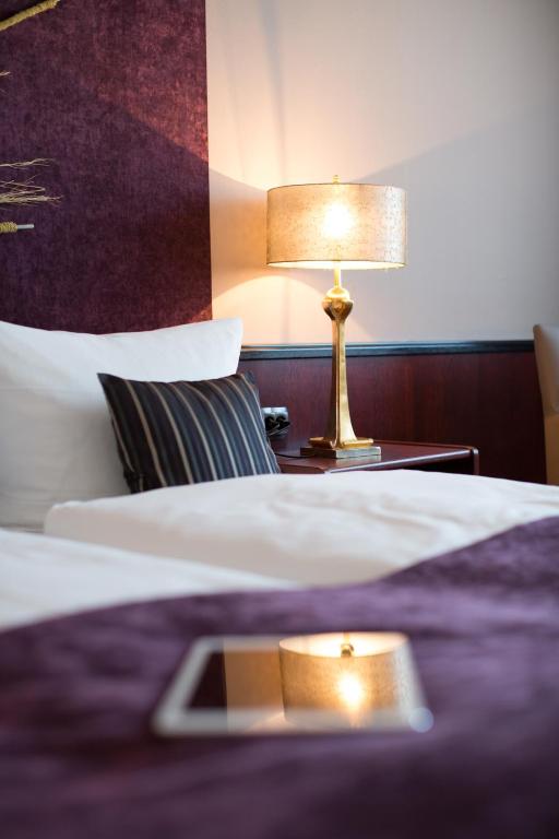Postel nebo postele na pokoji v ubytování Hotel Kristall