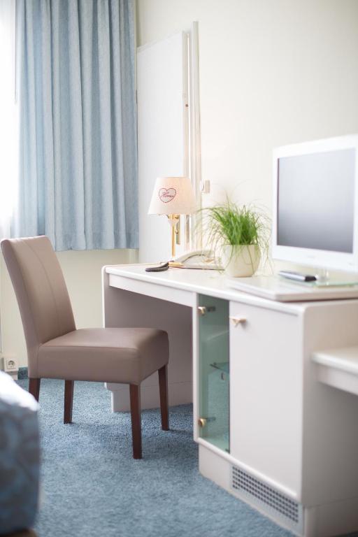 TV a/nebo společenská místnost v ubytování Hotel Kristall
