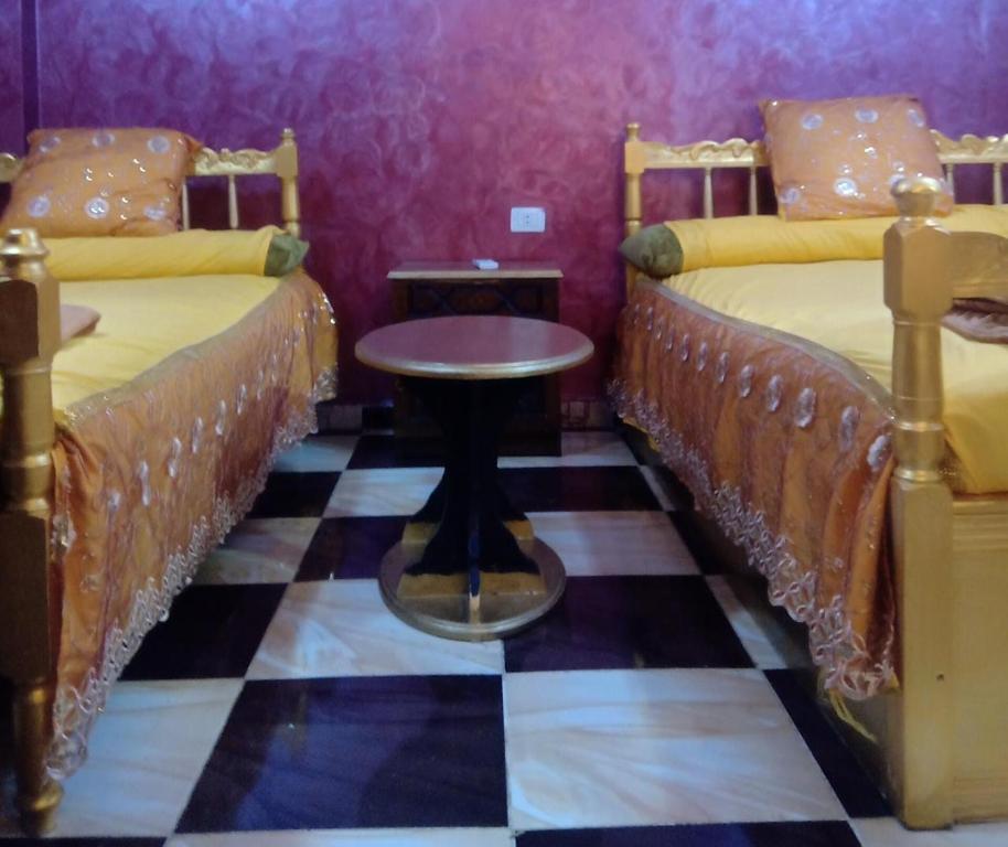 A bed or beds in a room at App11- BELAL - Enjoy the privacy of staying in a quiet apartment with free Wi-Fi as your complete second home in the heart of Hurghada