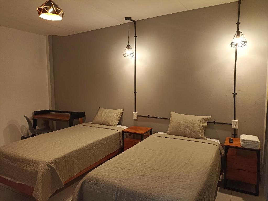 Postel nebo postele na pokoji v ubytování Bijao Hostel