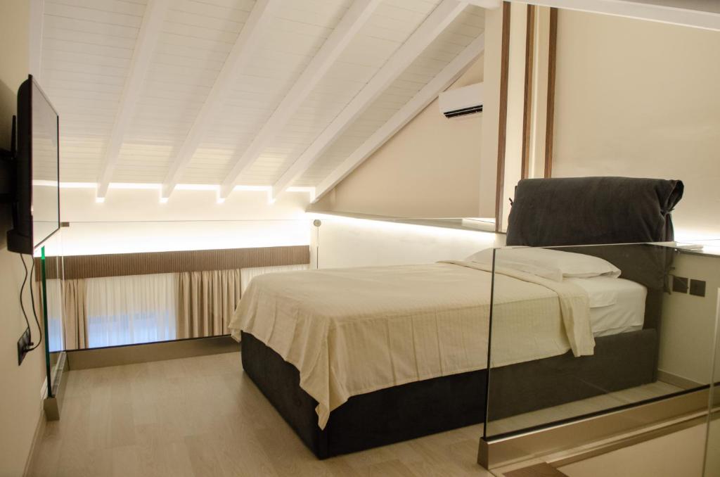 Posteľ alebo postele v izbe v ubytovaní Leone suites
