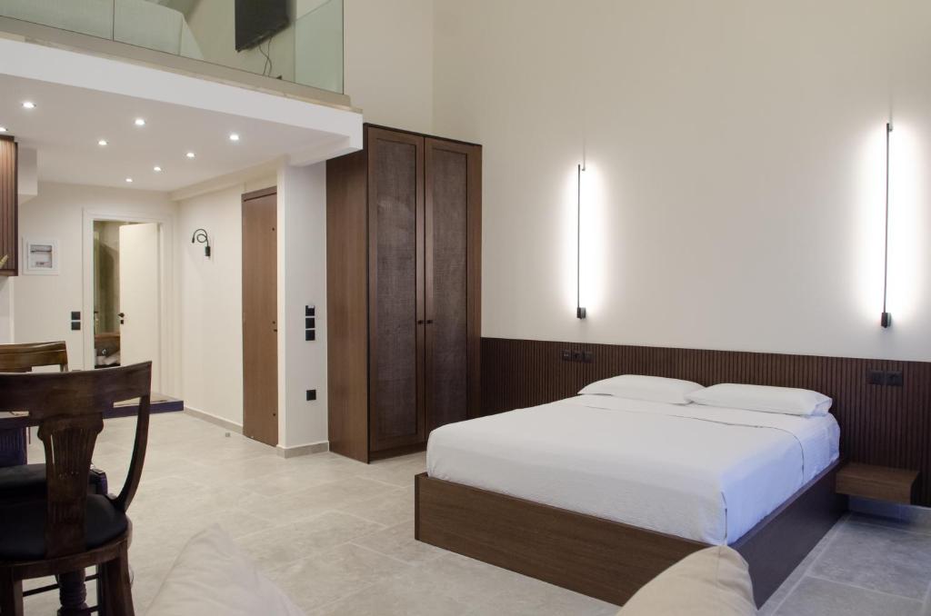 Ένα ή περισσότερα κρεβάτια σε δωμάτιο στο Leone suites