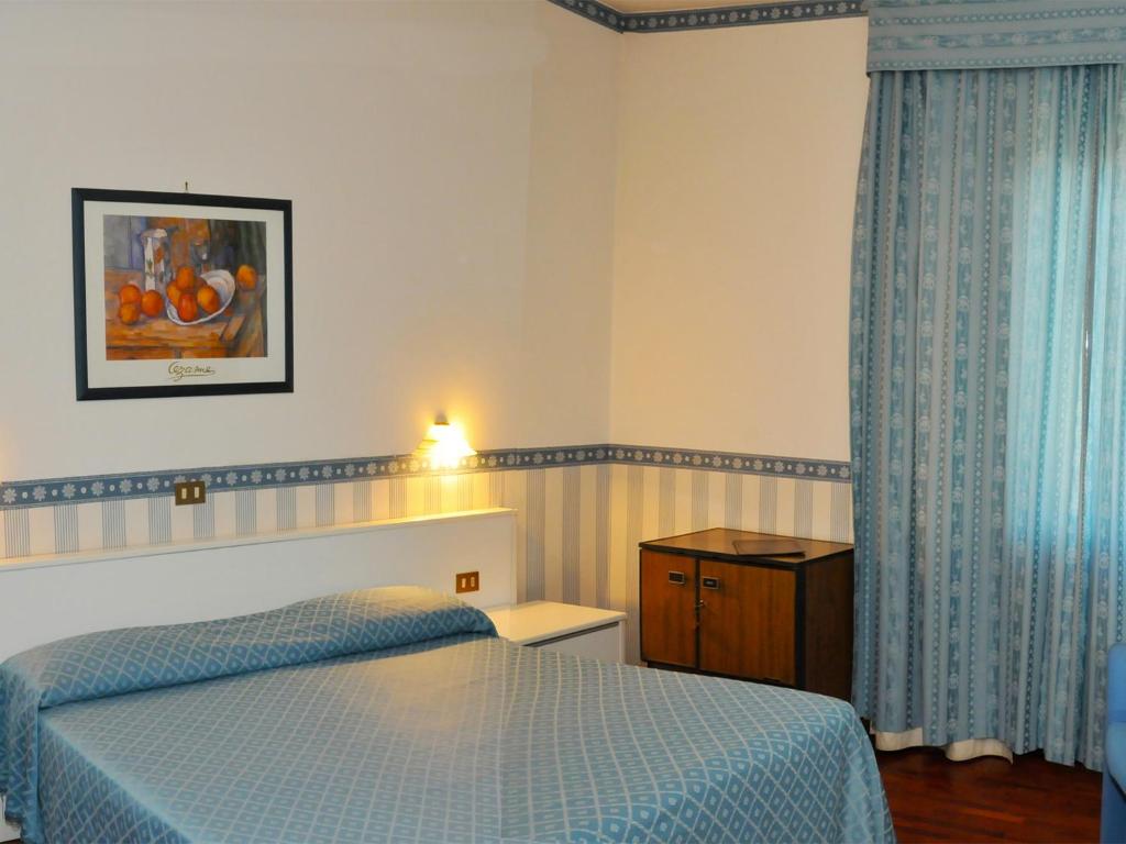 Postel nebo postele na pokoji v ubytování Hotel Altavilla