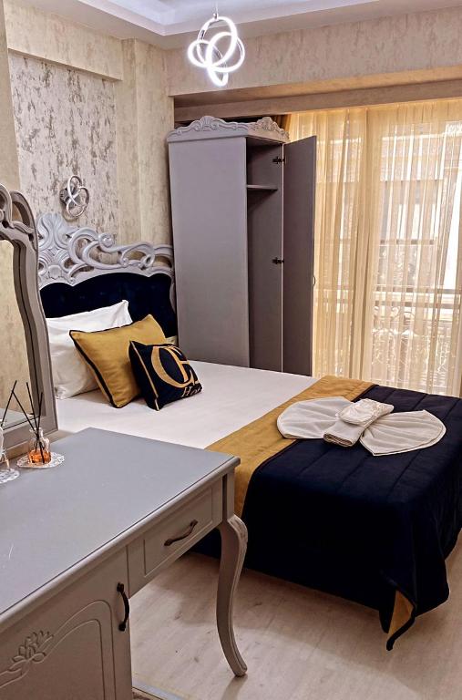 Postel nebo postele na pokoji v ubytování BALPETEK HOTEL