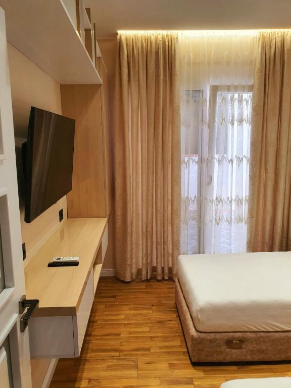 TV a/nebo společenská místnost v ubytování Olives Residence