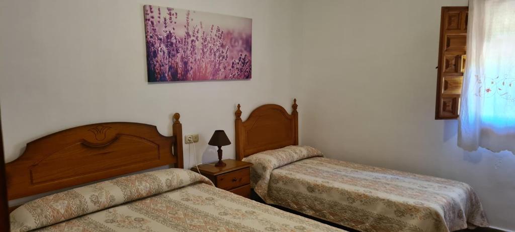 Postel nebo postele na pokoji v ubytování Alojamiento Turístico El Pantano de Cazorla