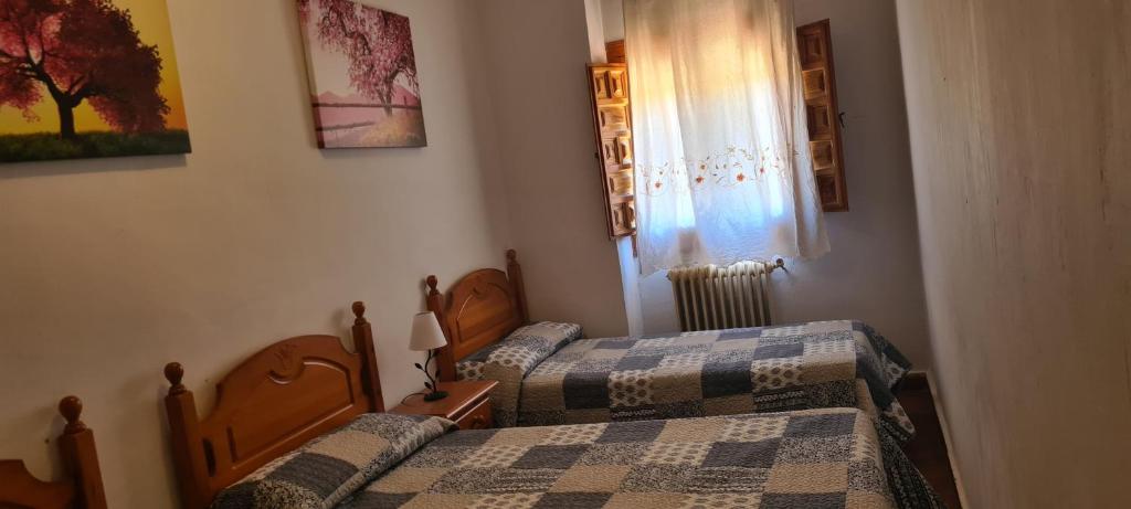 Postel nebo postele na pokoji v ubytování Alojamiento Turístico El Pantano de Cazorla