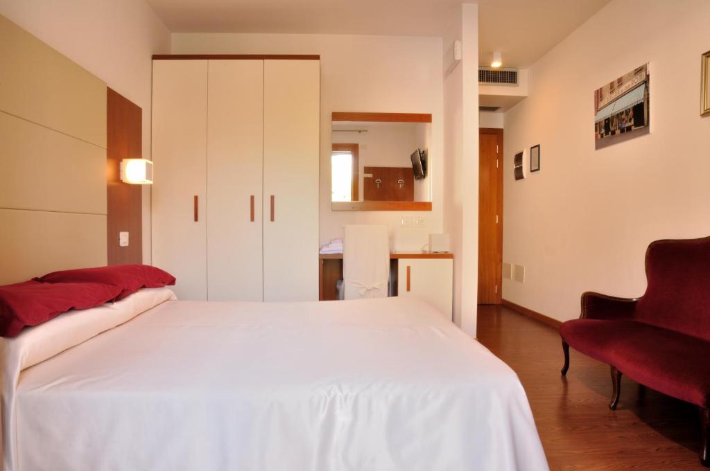 Postel nebo postele na pokoji v ubytování Hotel Mezzaluna