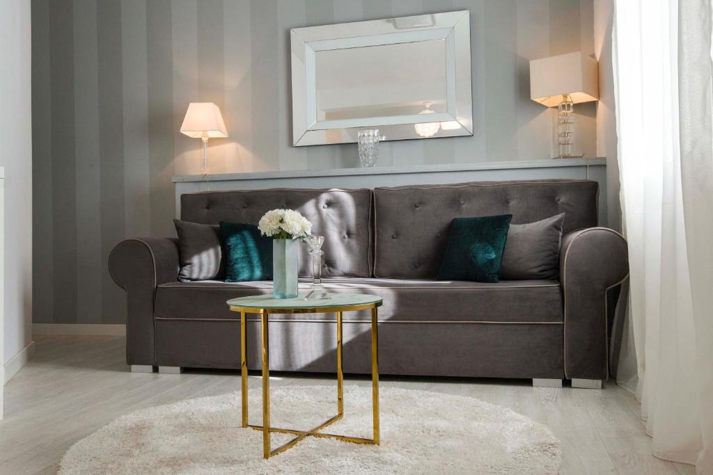 a living room with a couch and a table at LUX GARDEN Luxury Apartment Split in Split