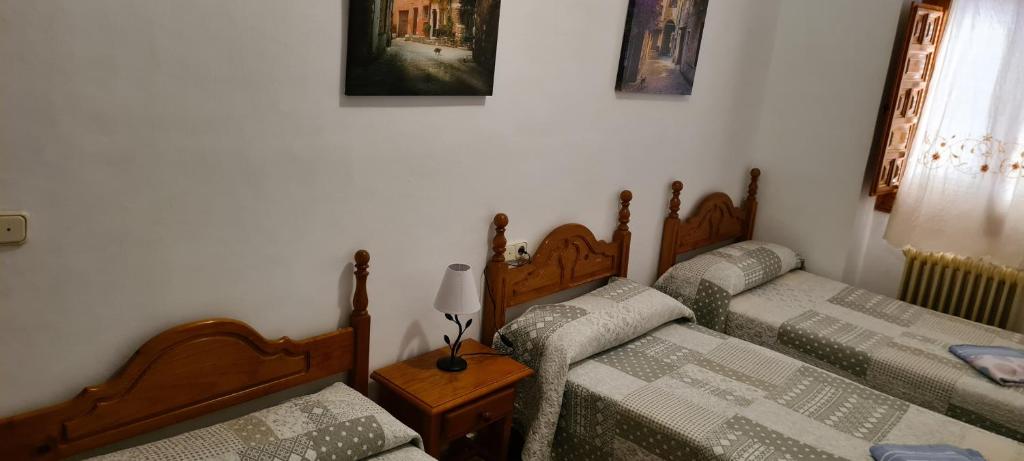 Postel nebo postele na pokoji v ubytování Alojamiento Turístico El Pantano de Cazorla