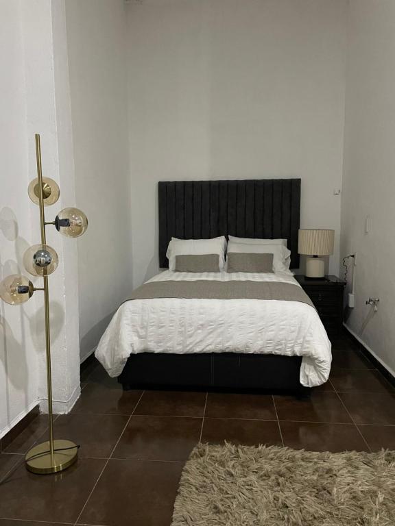 Postel nebo postele na pokoji v ubytování Suite Copal
