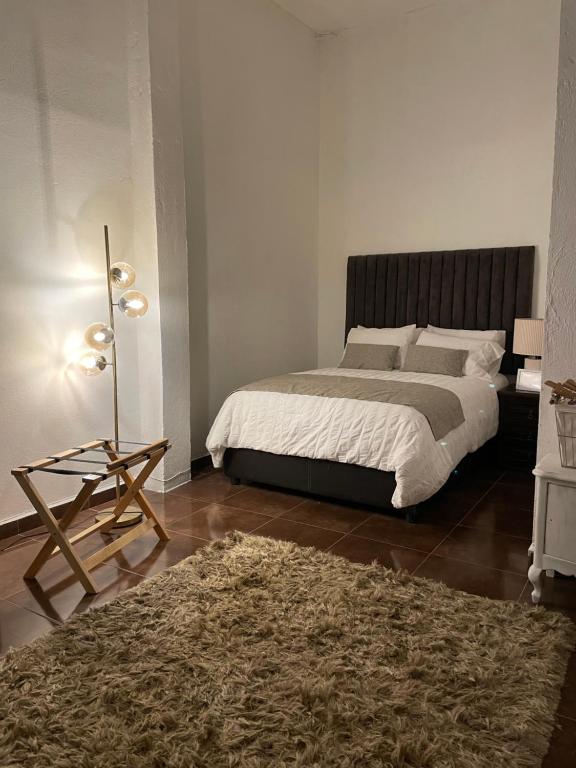 Postel nebo postele na pokoji v ubytování Suite Copal