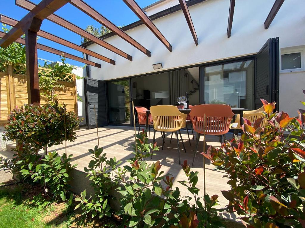 a patio with a table and chairs on it at Villa Klara in Vodice