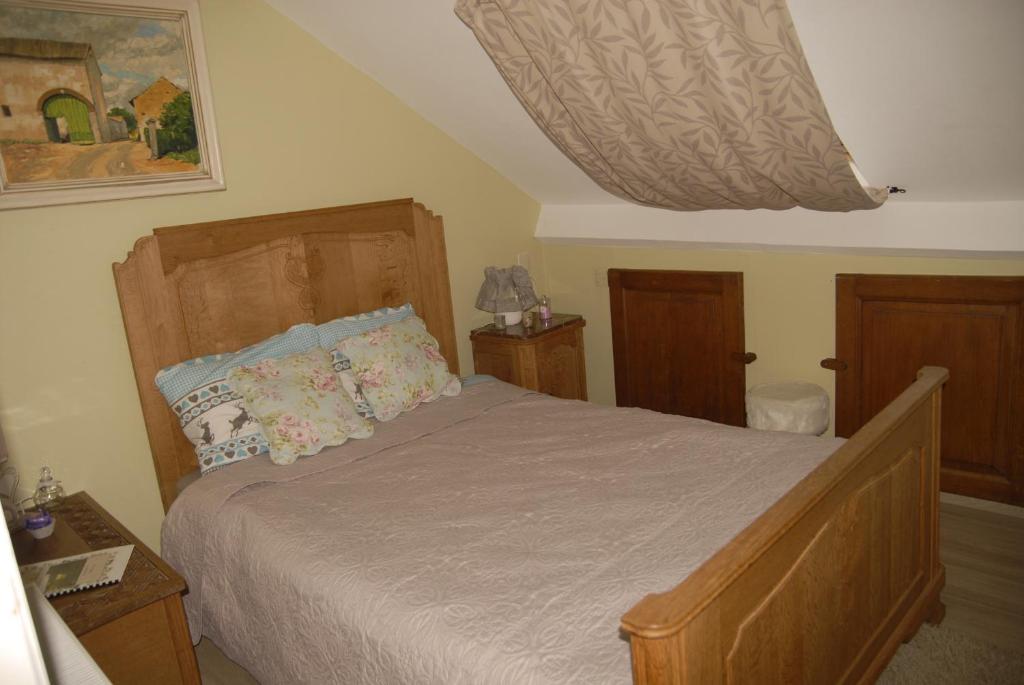 Postel nebo postele na pokoji v ubytování Le Clos Arboré (Gîte)