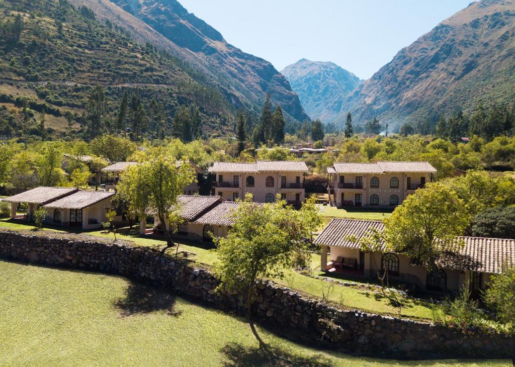 an aerial view of a village in the mountains at Inti Punku Valle Sagrado Hotel in Urubamba