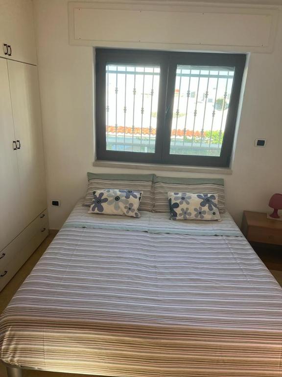 Postel nebo postele na pokoji v ubytování Casa Carlucci