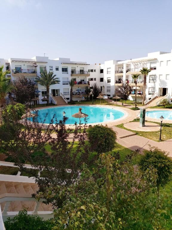 an overhead view of a swimming pool in a building at Bouznika DREAMS in Bouznika
