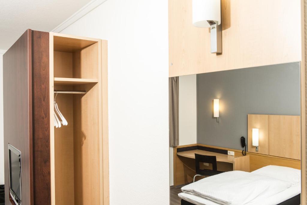 Postel nebo postele na pokoji v ubytování Good Morning Erfurt