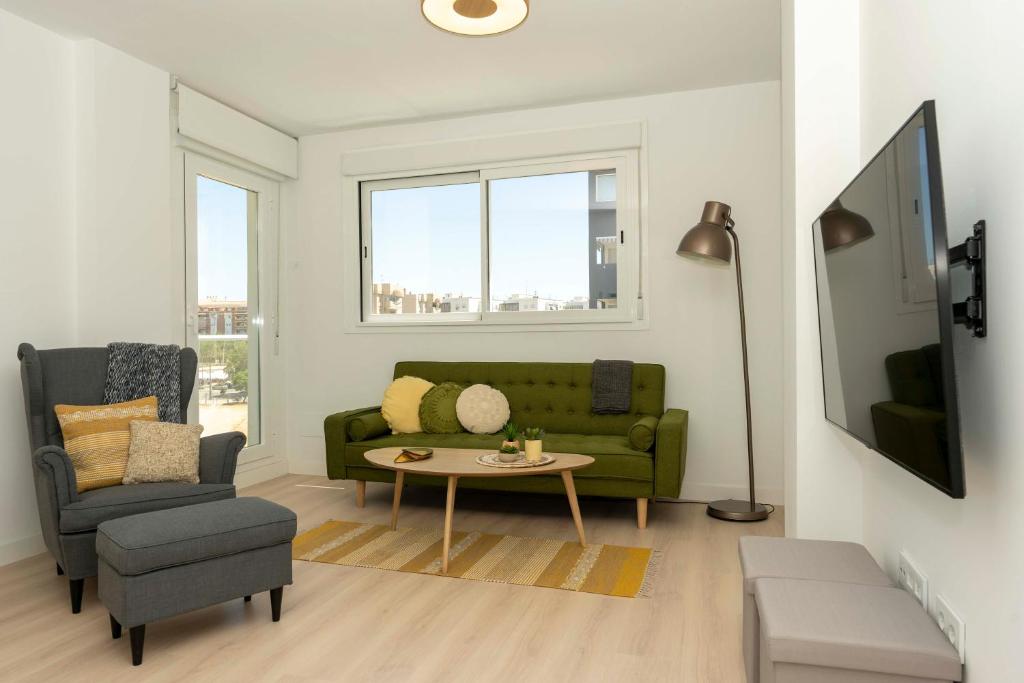 Televízia a/alebo spoločenská miestnosť v ubytovaní Apartamento de lujo de dos dormitorios