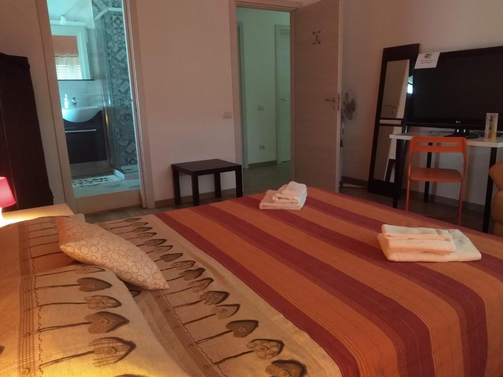 Postel nebo postele na pokoji v ubytování Orlando