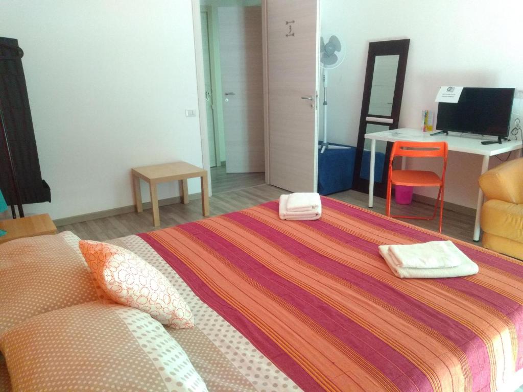 Postel nebo postele na pokoji v ubytování Orlando