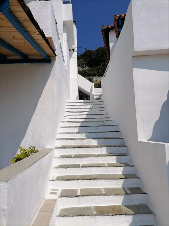 a staircase leading up to a white building at Alexandra's Studios in Kechria
