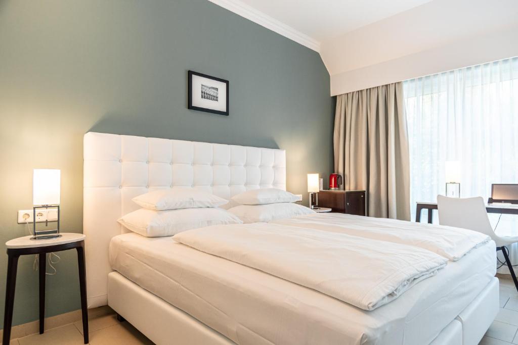 Postel nebo postele na pokoji v ubytování Hotel Spiess & Spiess