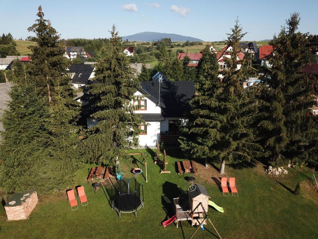 an aerial view of a park with chairs and trees at Noclegi nad Czarną Orawą in Podwilk