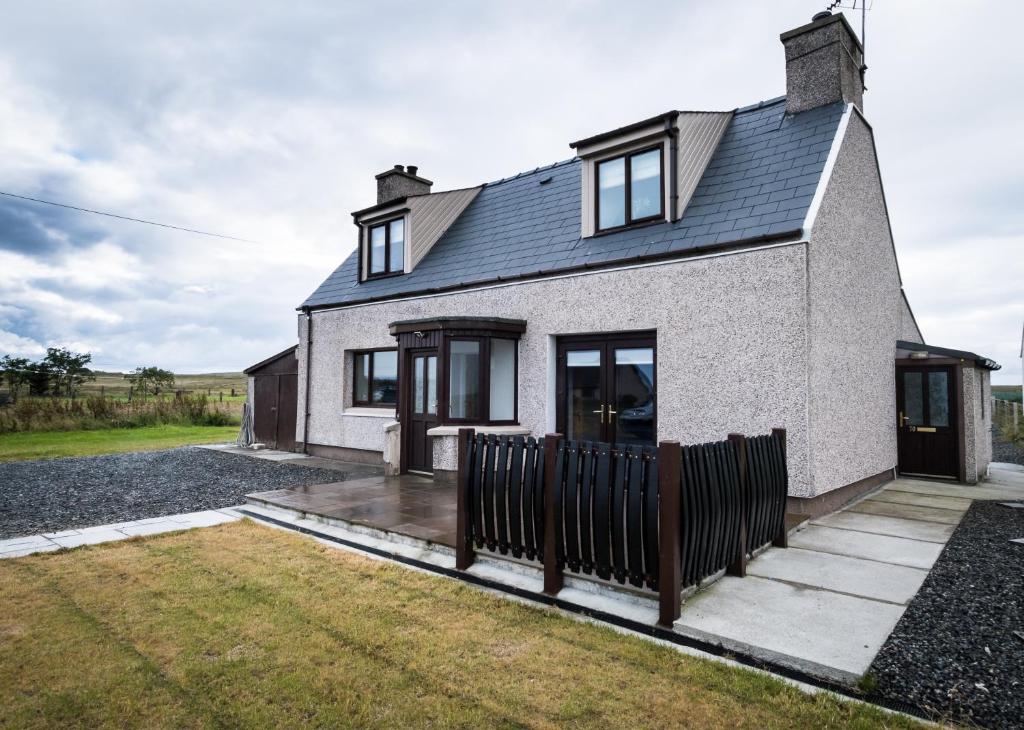 a house with a black fence in front of it at No.70 in Bayble