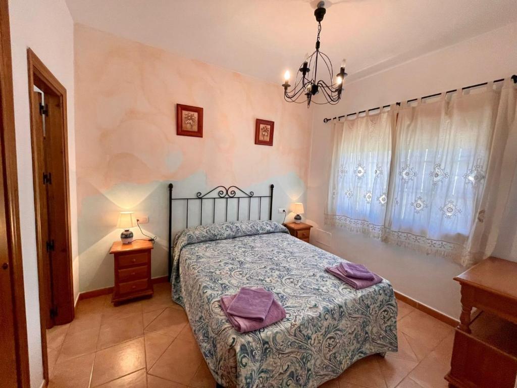 Posteľ alebo postele v izbe v ubytovaní FINCA EL ALMENDRO