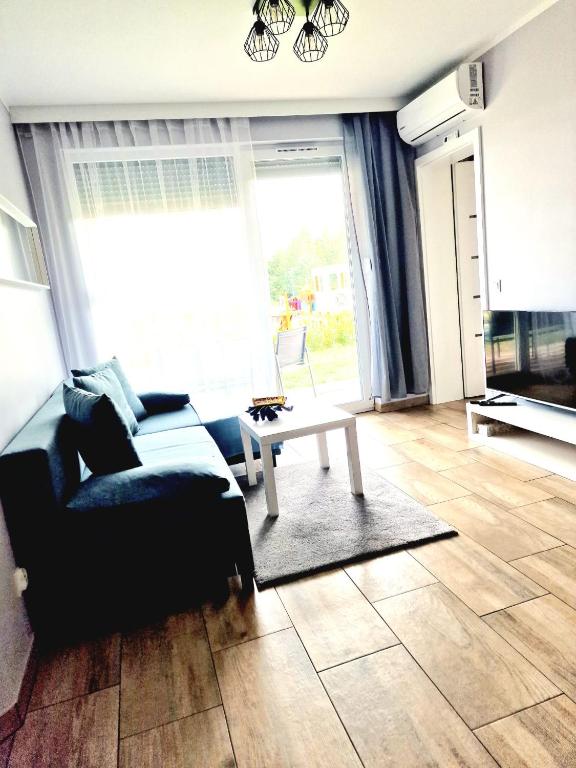 Posedenie v ubytovaní Apartament z basenem i ogródkiem Baltic Sun A17
