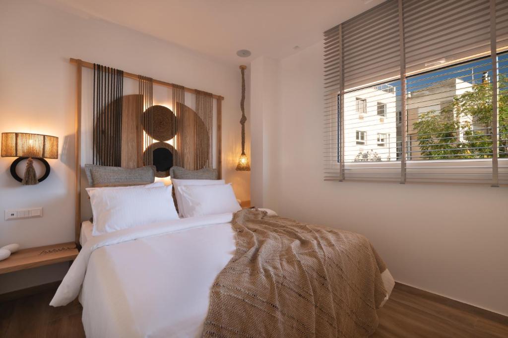 A bed or beds in a room at Apollonos at Heart of Plaka