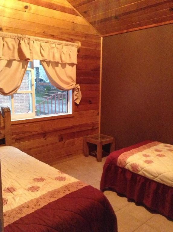 Postel nebo postele na pokoji v ubytování Cabanas El Cerrito