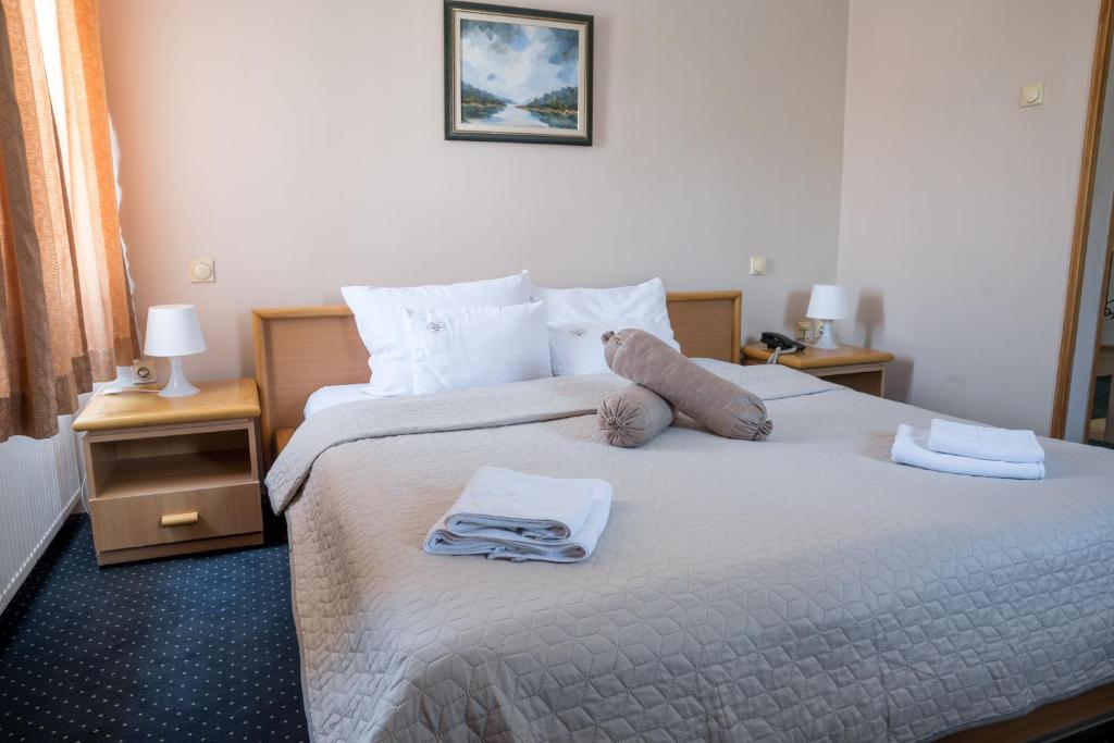 Voodi või voodid majutusasutuse Garni Hotel Panorama Lux toas