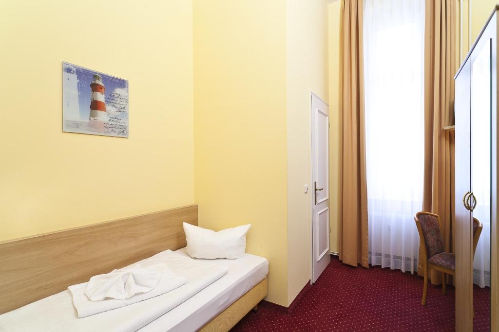 Postel nebo postele na pokoji v ubytování Hotel Vivaldi Berlin am Kurfürstendamm