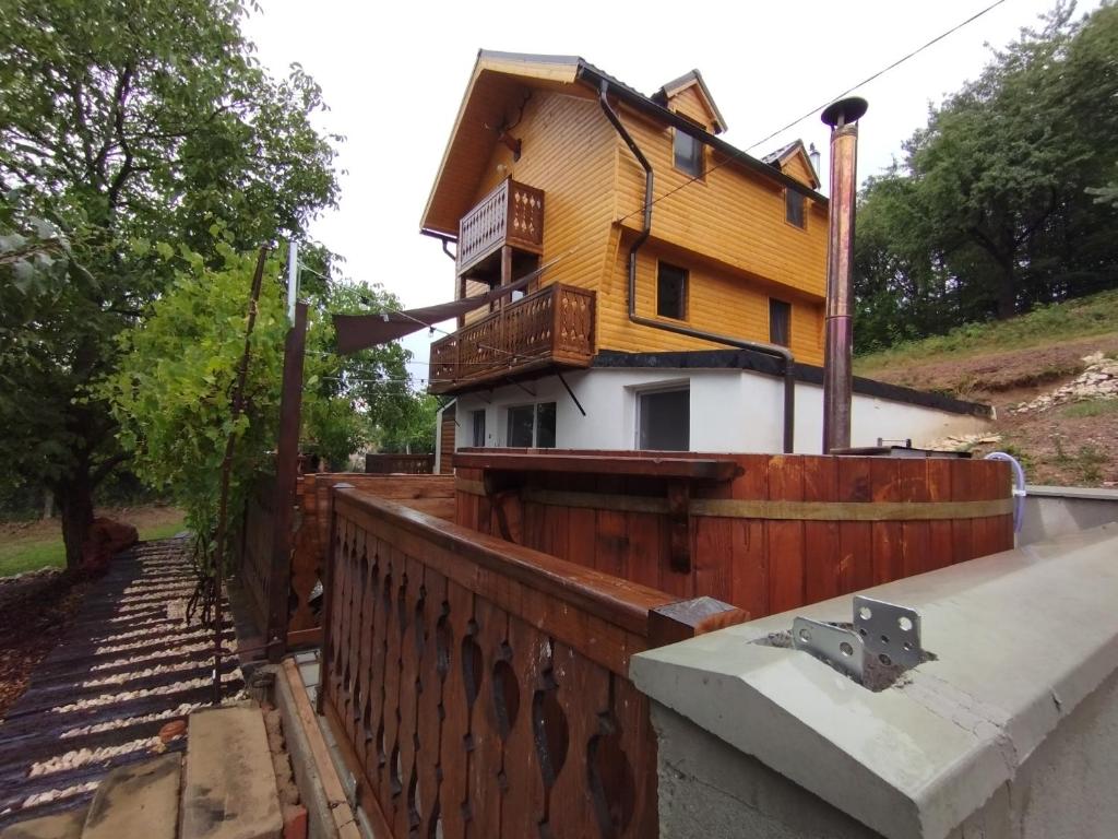 a house that is on top of a fence at Rotwild House in Bicfălău