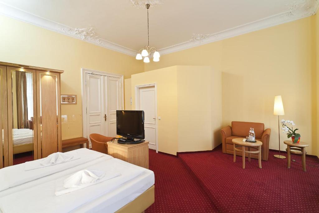 Postel nebo postele na pokoji v ubytování Hotel Vivaldi Berlin am Kurfürstendamm