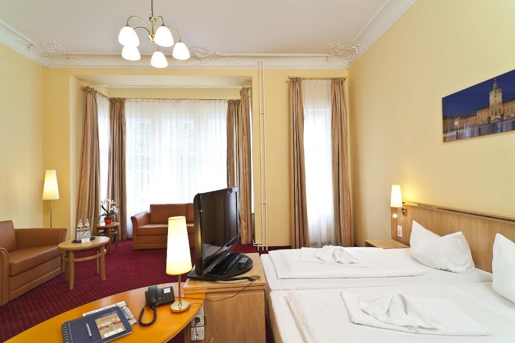 Postel nebo postele na pokoji v ubytování Hotel Vivaldi Berlin am Kurfürstendamm