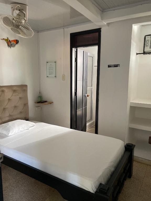 Postel nebo postele na pokoji v ubytování BOUTIQUE HOTEL BALOP Valledupar