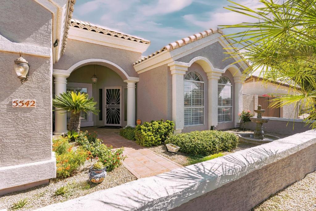 a large house with a walkway in front of it at Private Tuscany Oasis with Pool - Perfect for families, couples or business travelers home in Phoenix