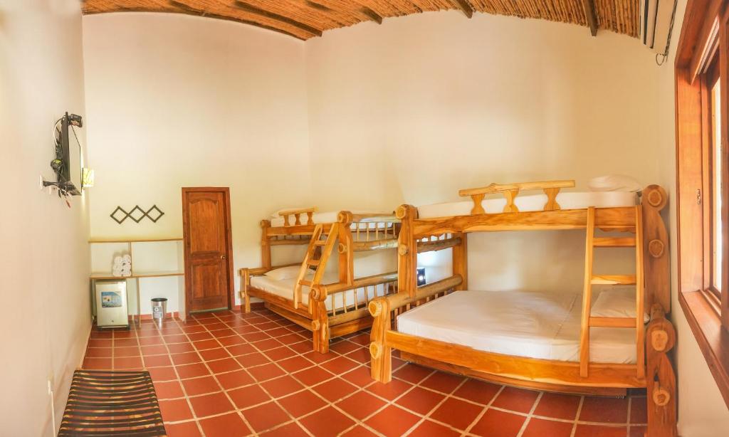 Postel nebo postele na pokoji v ubytování Hotel Brisas La Gaviota Mariquit-Tolima