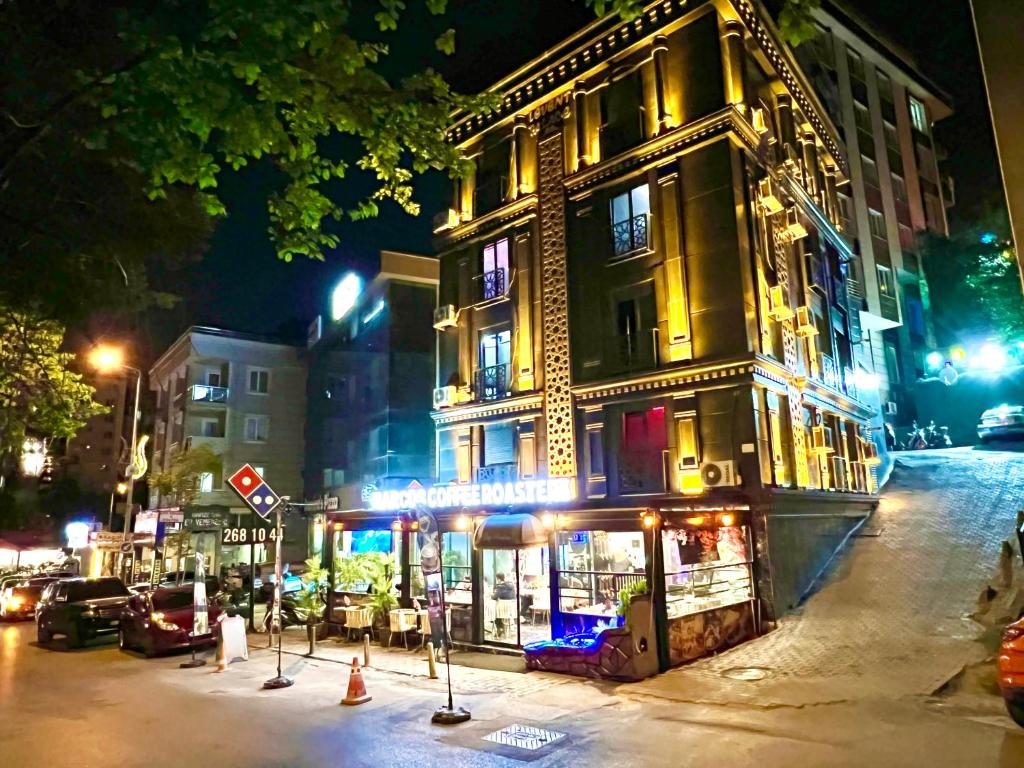 a building on a city street at night at LEVENT PALACE OTEL in Istanbul