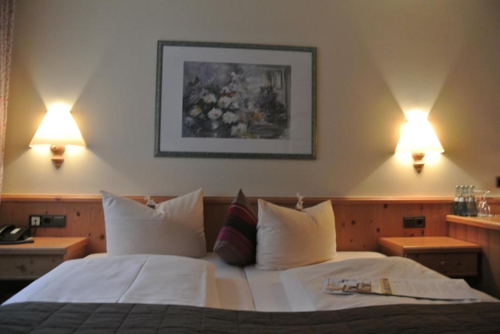 Postel nebo postele na pokoji v ubytování AKZENT Hotel Am Bach