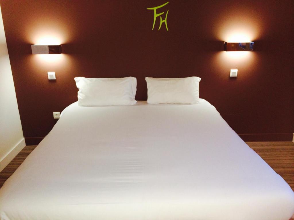 Postel nebo postele na pokoji v ubytování Fasthotel Dunkerque
