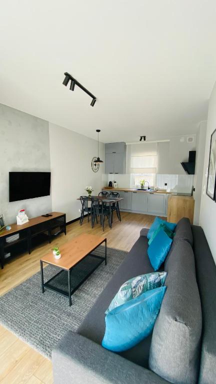 Telewizja i/lub zestaw kina domowego w obiekcie LM APARTAMENTY NARUTOWICZA Kamienica Nova 2-3