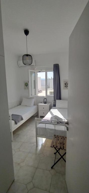 Posteľ alebo postele v izbe v ubytovaní Camara House, Antiparos