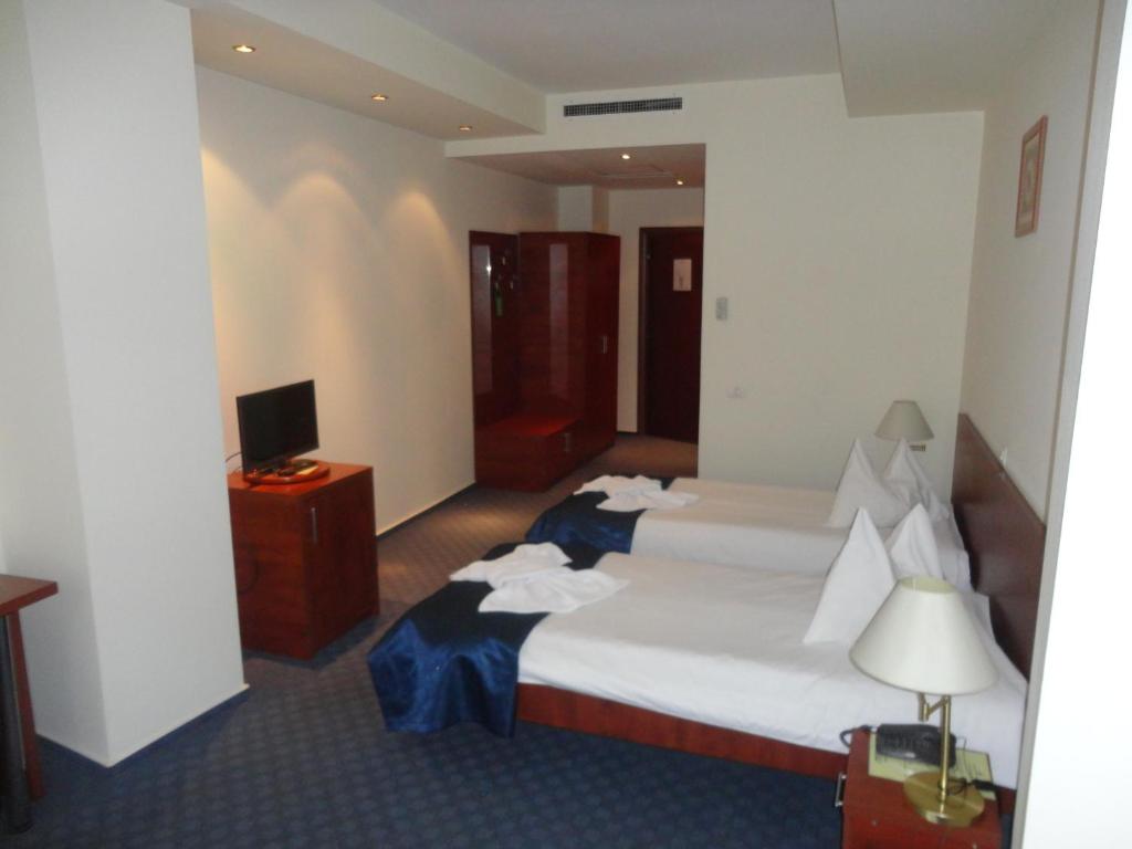 Postel nebo postele na pokoji v ubytování Samaa Hotel