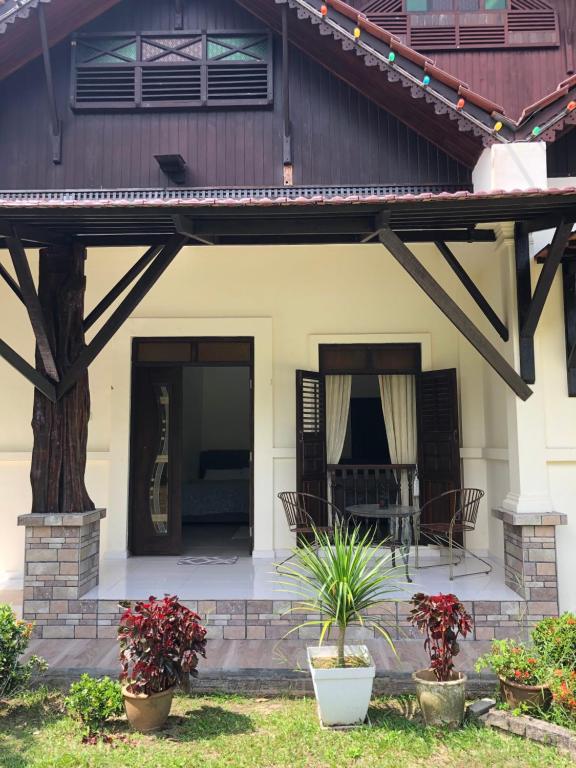a porch of a house with a patio at One-Room Homestay 81B Muar in Muar