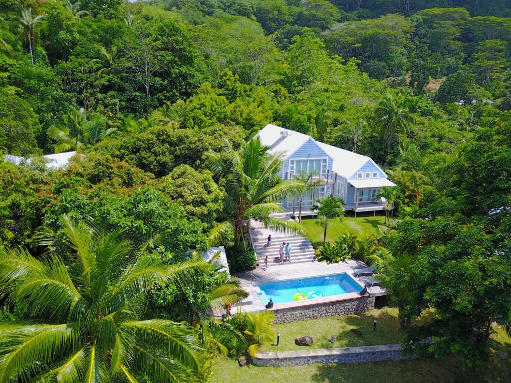 an aerial view of a house with a swimming pool at Red Coconut Self-Catering in Mahe