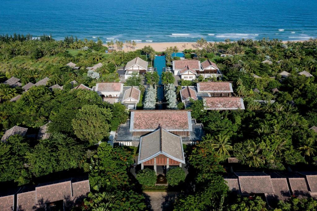 an aerial view of a resort with the ocean in the background at Narada Resort & Spa Perfume Bay Sanya - All Villas in Lingshui